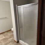 Frosted glass shower doors in a modern bathroom