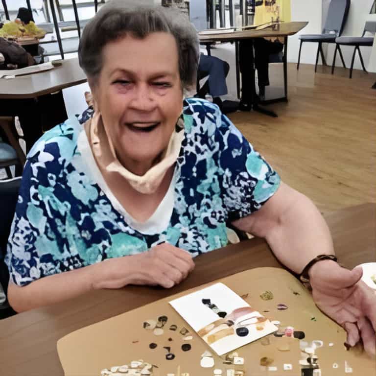 Senior woman enjoying a puzzle game indoors.