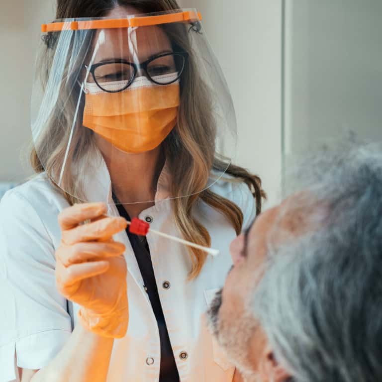 Healthcare worker performing a nasal swab test.