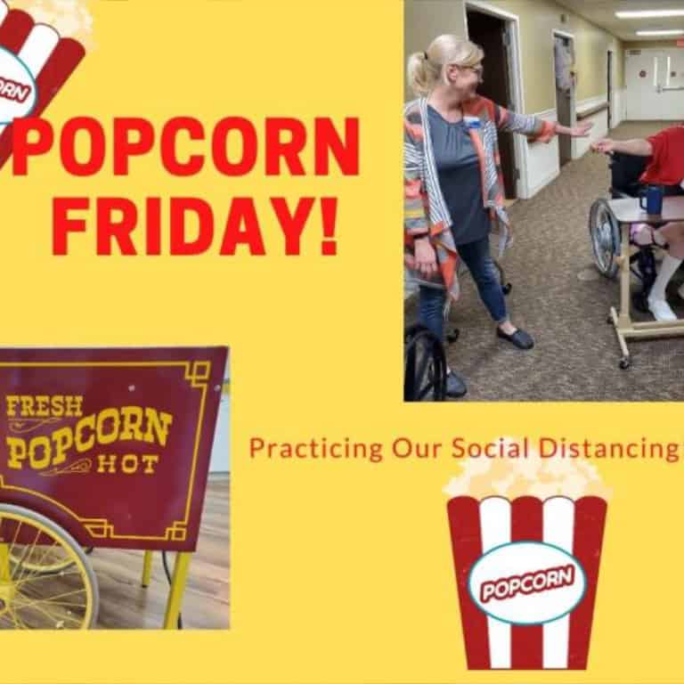 Social distancing during popcorn Friday event.